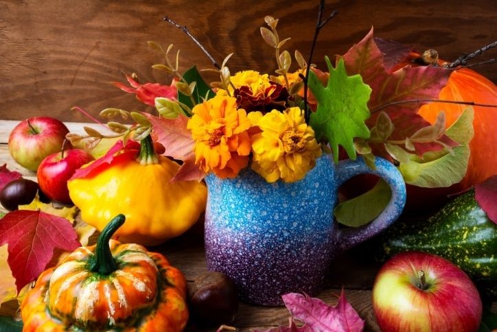 Colorful fall decorative leaves, fruits and vegetables.