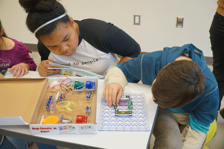 Elementary school kids working on science project.