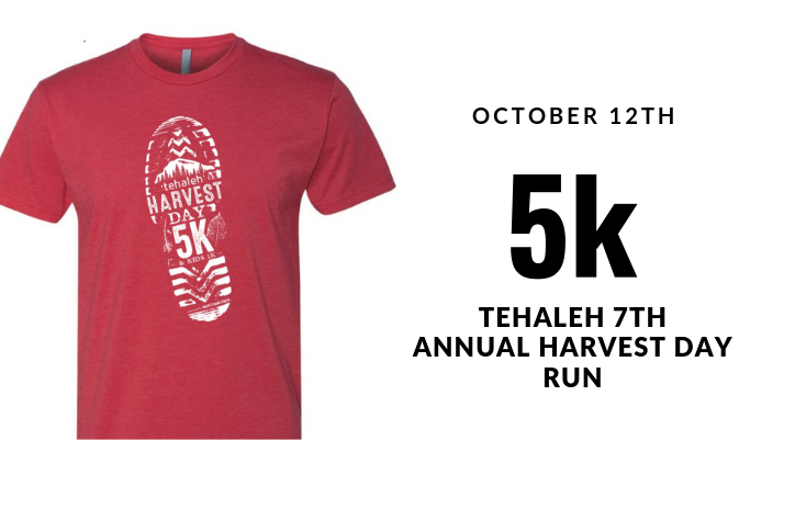 Tehaleh Annual 5k Harvest Day Run red T-shirt with footprint.