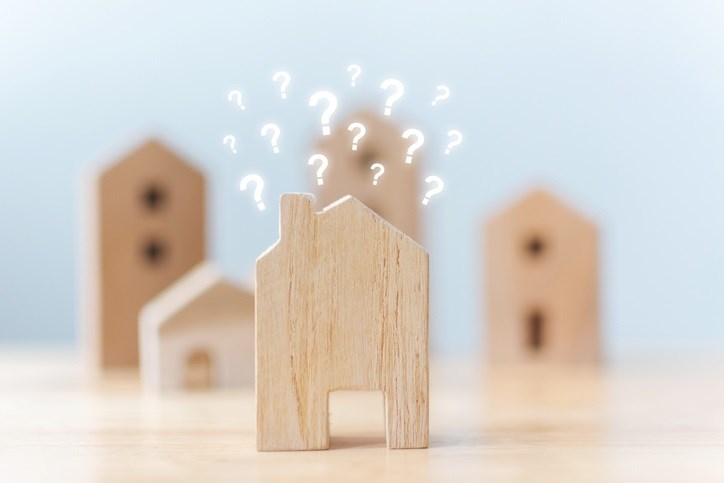 Wooden blocks with question marks representing mortgage questions.