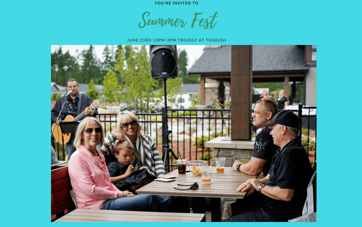 Family having lunch at outside table during summer fest in Tehaleh.