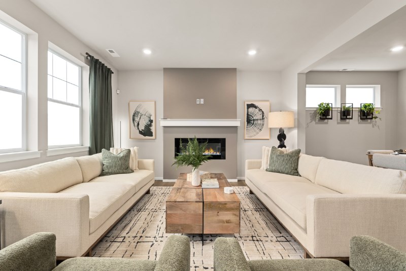 A sleek, modern living room by D.R. Horton in Tehaleh, WA.