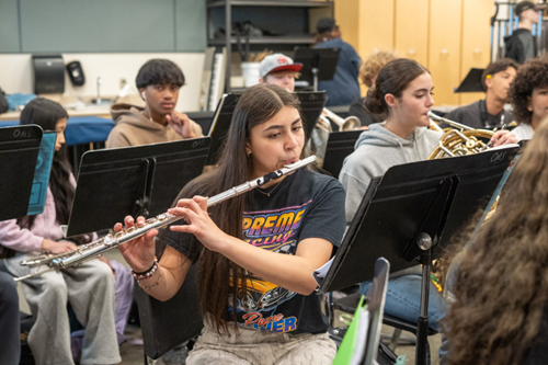 Orting student plays the flute in their music class.