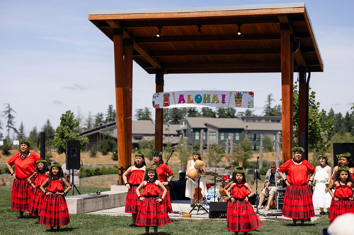 Luau dancers gather at the amphitheater in Discovery Park